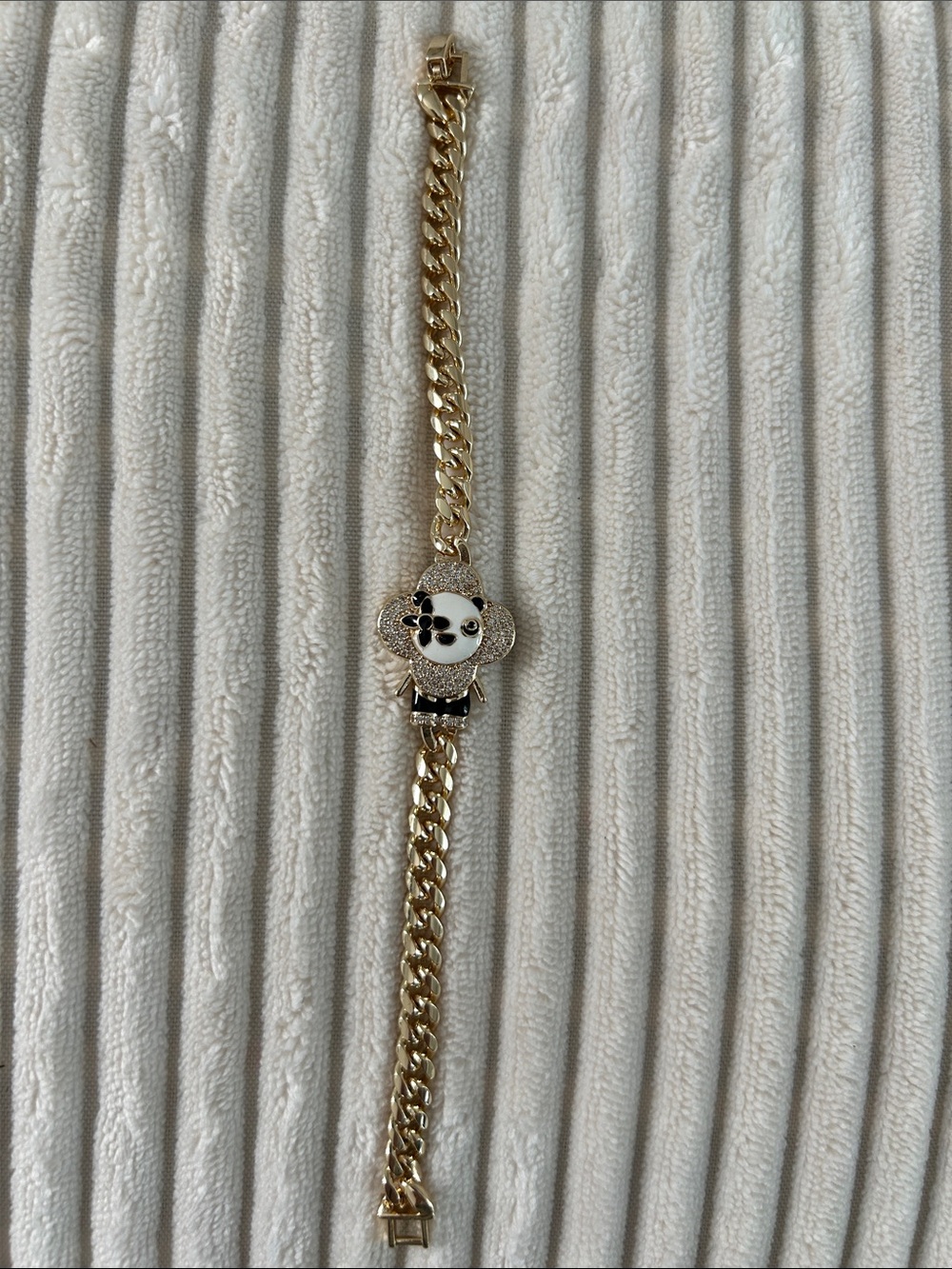 Gold Tone Vivi Crystal Charm Bracelet with Black and White Enamel. 6.5”